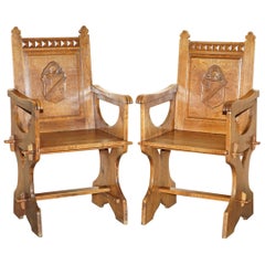 Pair of Antique Carved English Oak Armchairs with Armorial Crest Coat of Arms
