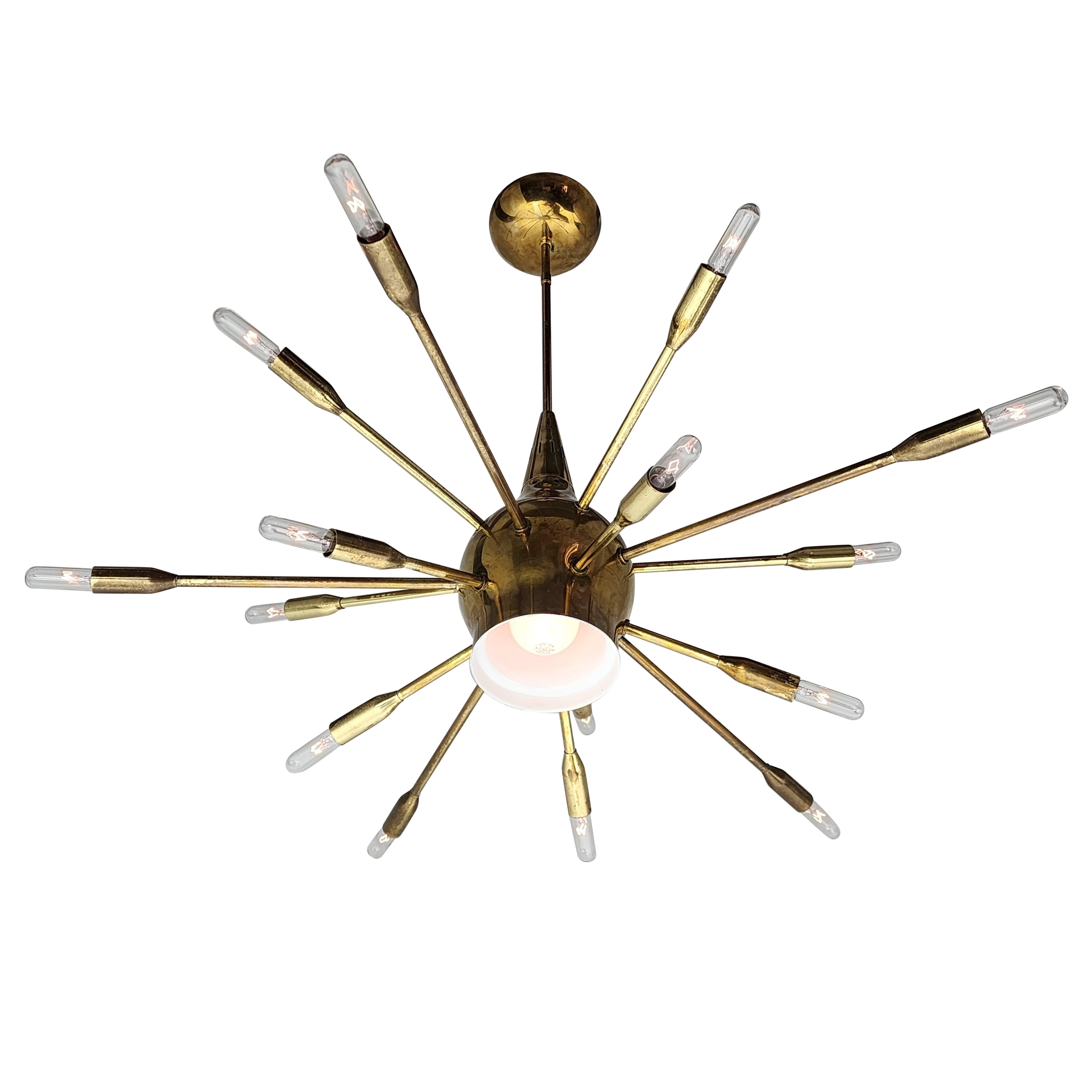 Unique, bold brass sputnik 15 arm chandelier with downward light . 

Contain 15 E12 candelabra size socket rated at 40 watt each . 

Down light has a E26 edison base size socket . 

