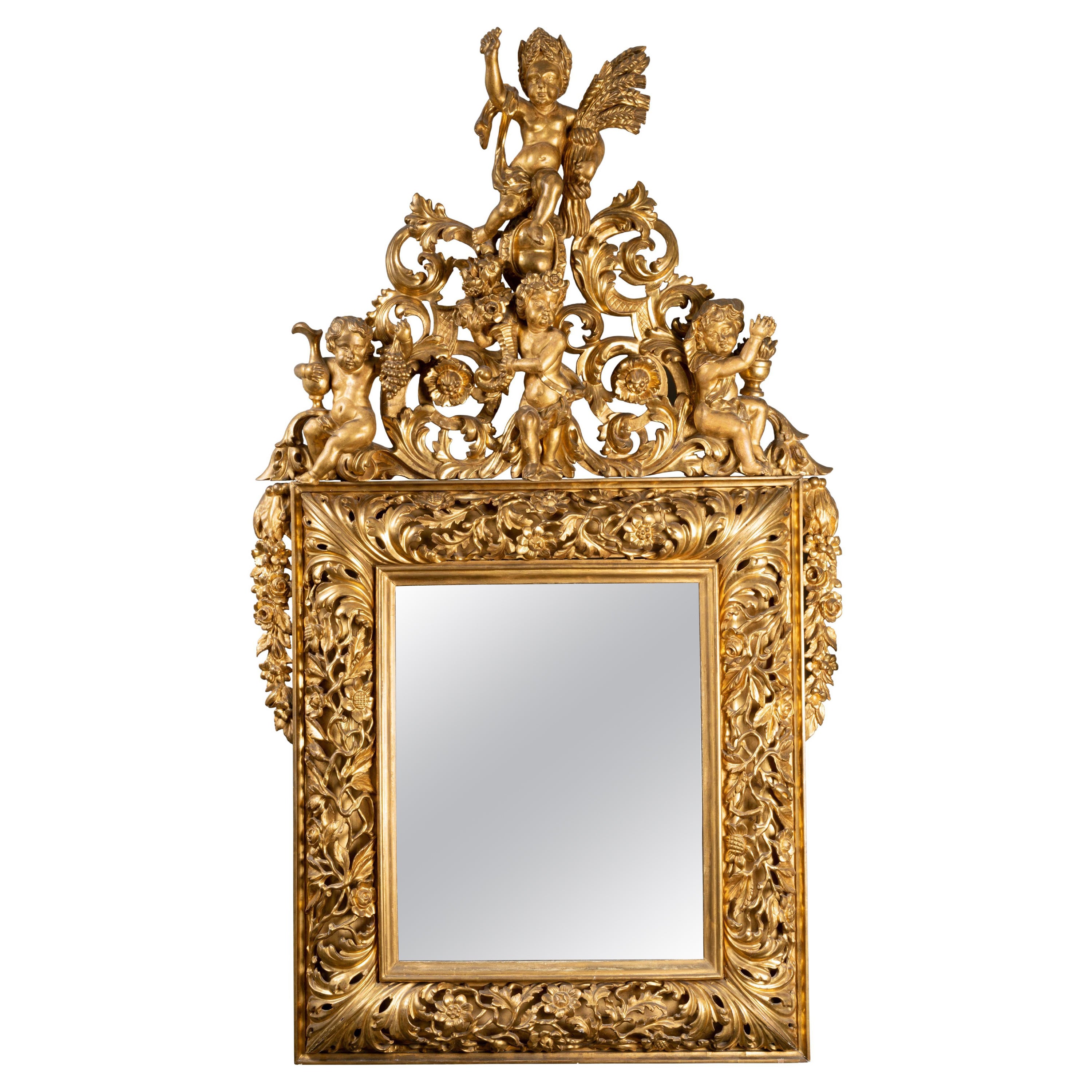 Early 18th Century Italian Carved Giltwood Mirror Depicting Four Seasons For Sale