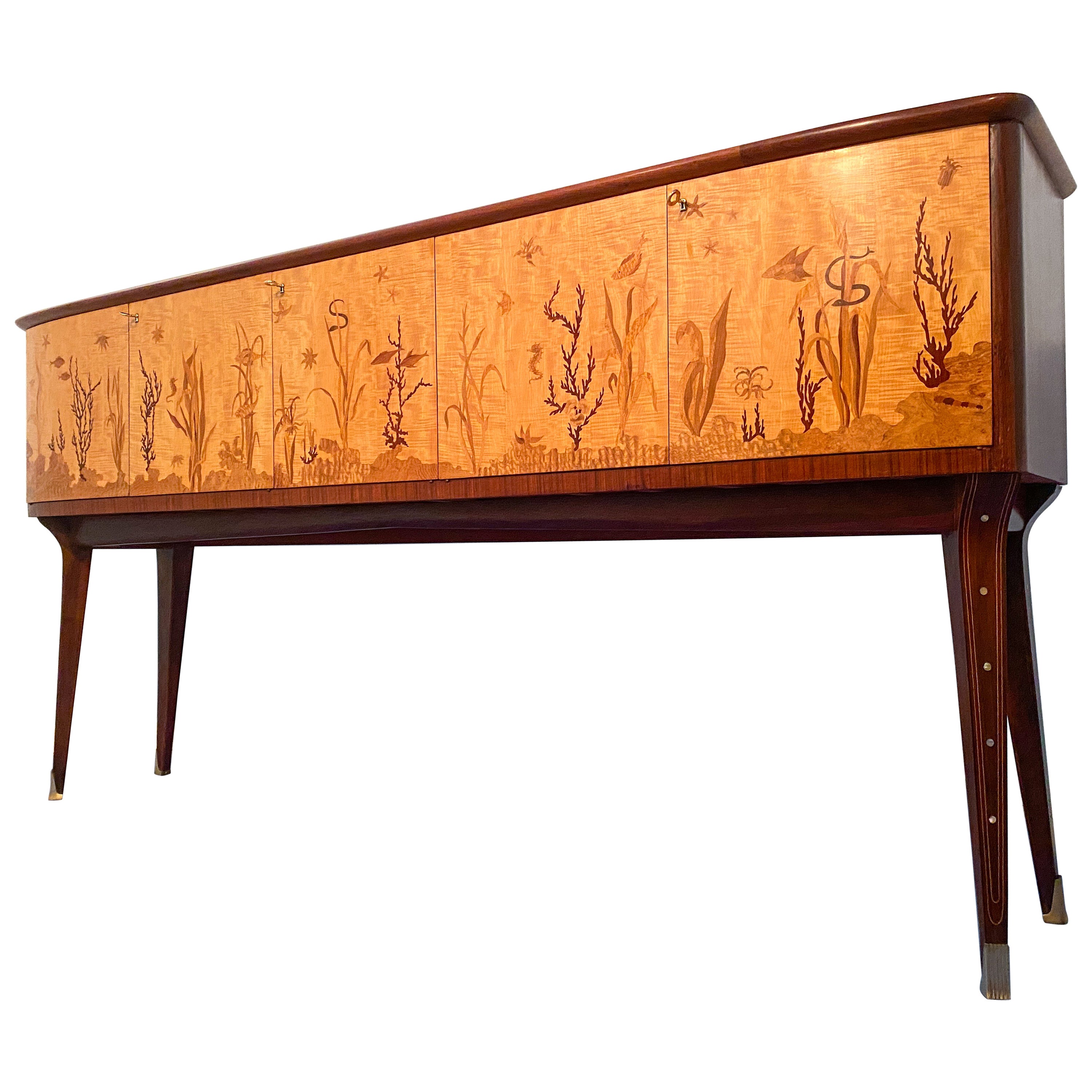 This Italian sideboard from the 1950s is truly exquisite, with its intricate hand-inlaid design by the renowned artist, inlayer, and marquetry master, Andrea Gusmai (Trani 1 May 1902-30 March 1992). The sideboard boasts an elegant and refined
