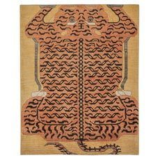 Tapis en peau de tigre personnalisé de Rug & Kilim avec pictogramme orange et marron