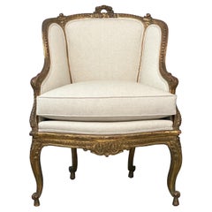 Sillón francés de madera dorada estilo Luis XV