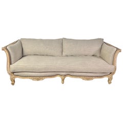 1930s French Carved Sofa with Linen Cushions 