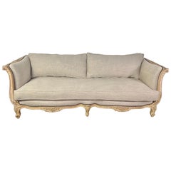 1930s French Carved Sofa with Linen Cushions