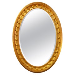 English 19th Century Oval Molded Gold Leaf Beveled Mirror with Balls