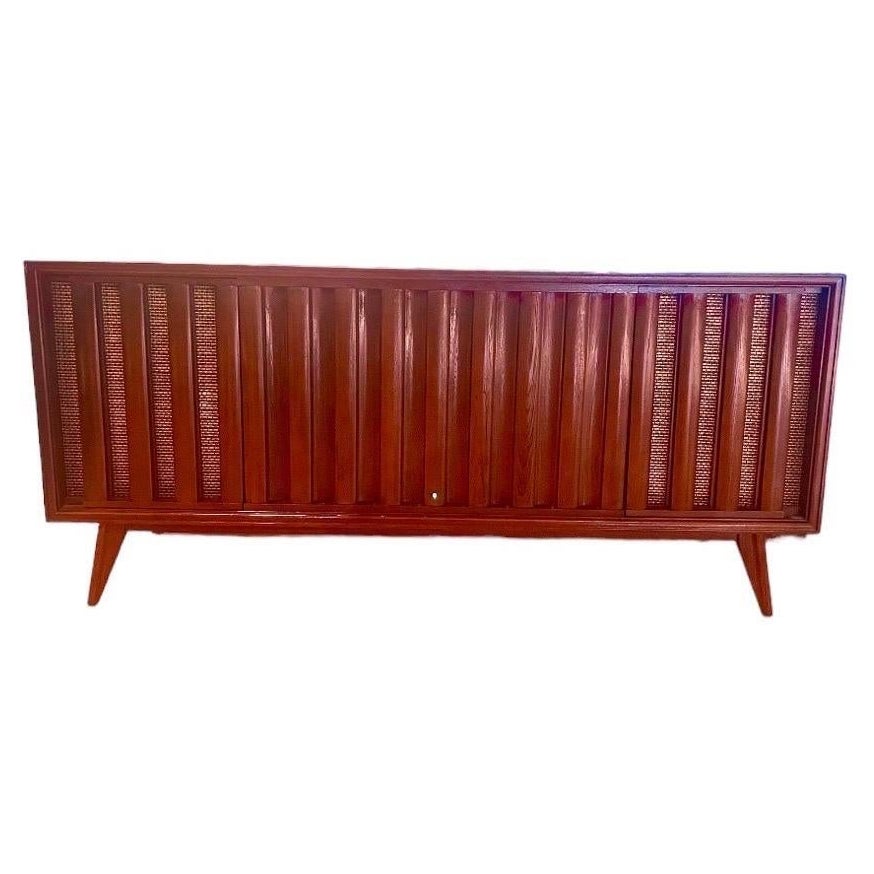 “If art decorates space… and music is the art that decorates time, then our vintage stereo consoles decorate lives by accentuating both.”  Groovy Wood Studios

This console:
This is a console refurbished by Groovy Wood Studios.  We acquire our