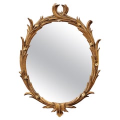 18th Century English Chippendale Oval Giltwood Mirror with foliage design