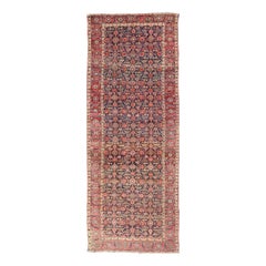 Milieu du 19e siècle, vers 1850 Tapis persan ancien de la galerie Joshegan en champ bleu 