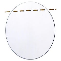 Round Sewn Mirror in Low Iron Clear Glass with Satin Brass Stitches
