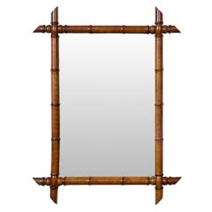 French Turn of the Century Brown Faux Bamboo Mirror with Intersecting Corners