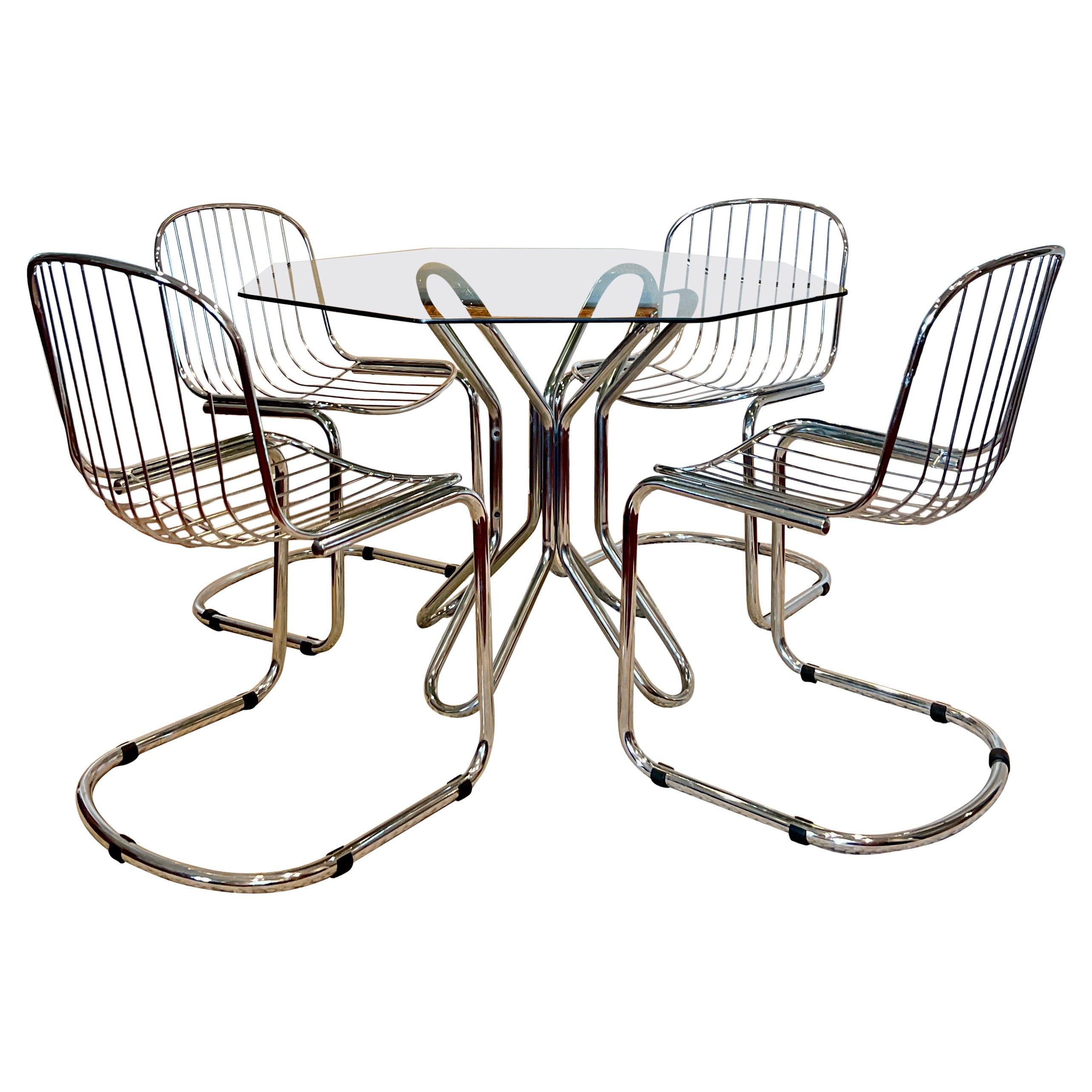 This exceptional vintage Italian dining set is in the style of Gastone Rinaldi and consists of 4 chairs only. The dining table has SOLD.

The chrome is in very good condition with minimal wear. For more comfort, you can place your own pillow of your