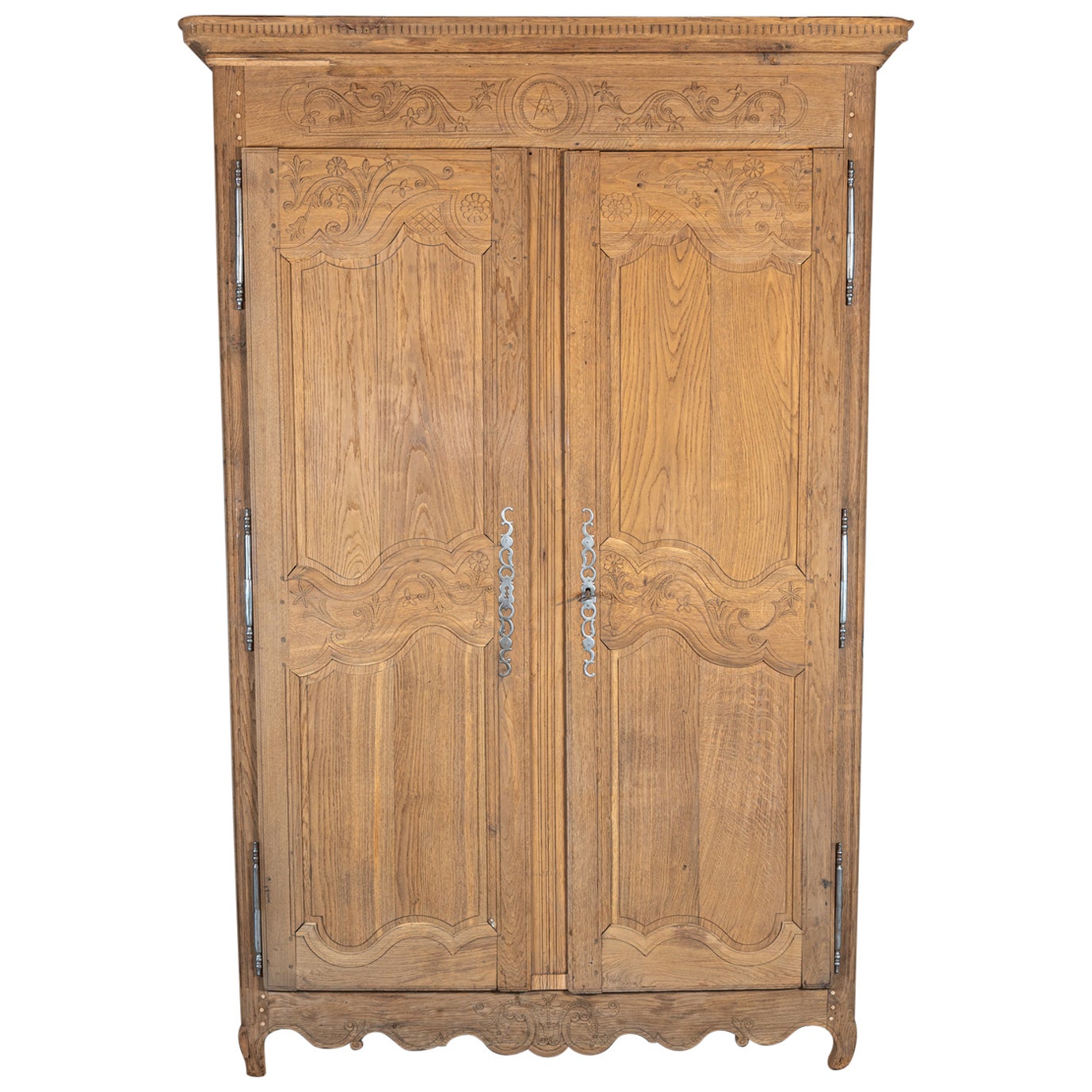 Experience the grandeur and elegance of this impressive 19th century French Louis XV Style armoire, now reimagined as a stunning bar cabinet. Meticulously restored by skilled craftsmen, this armoire has been professionally cleaned, sanded, and