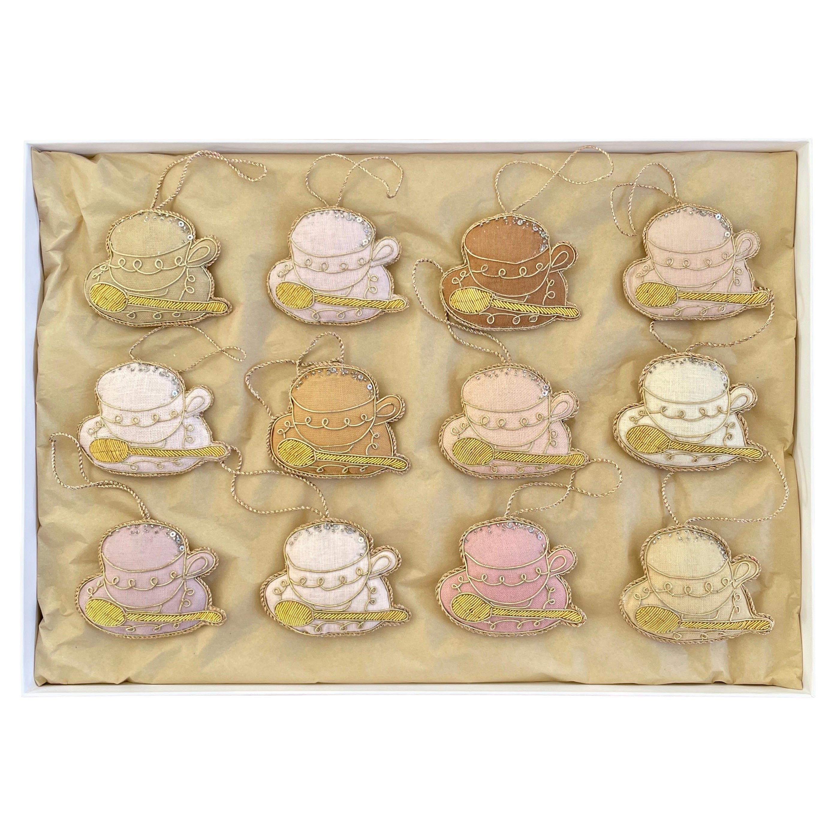 Set of 12 limited Edition Artisan Irish Linen teacup ornaments in pastels by Katie Larmour 

This is a luxury box set of artisan made decorative ornaments created with authentic Irish Linen, exclusive to 1stdibs. They are special because they are
