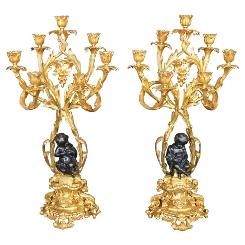 Pair of Bronze Putti Candelabras For Sale