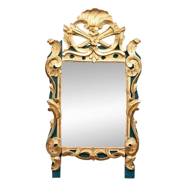 Miroir ancien sculpté et doré du 18ème siècle
