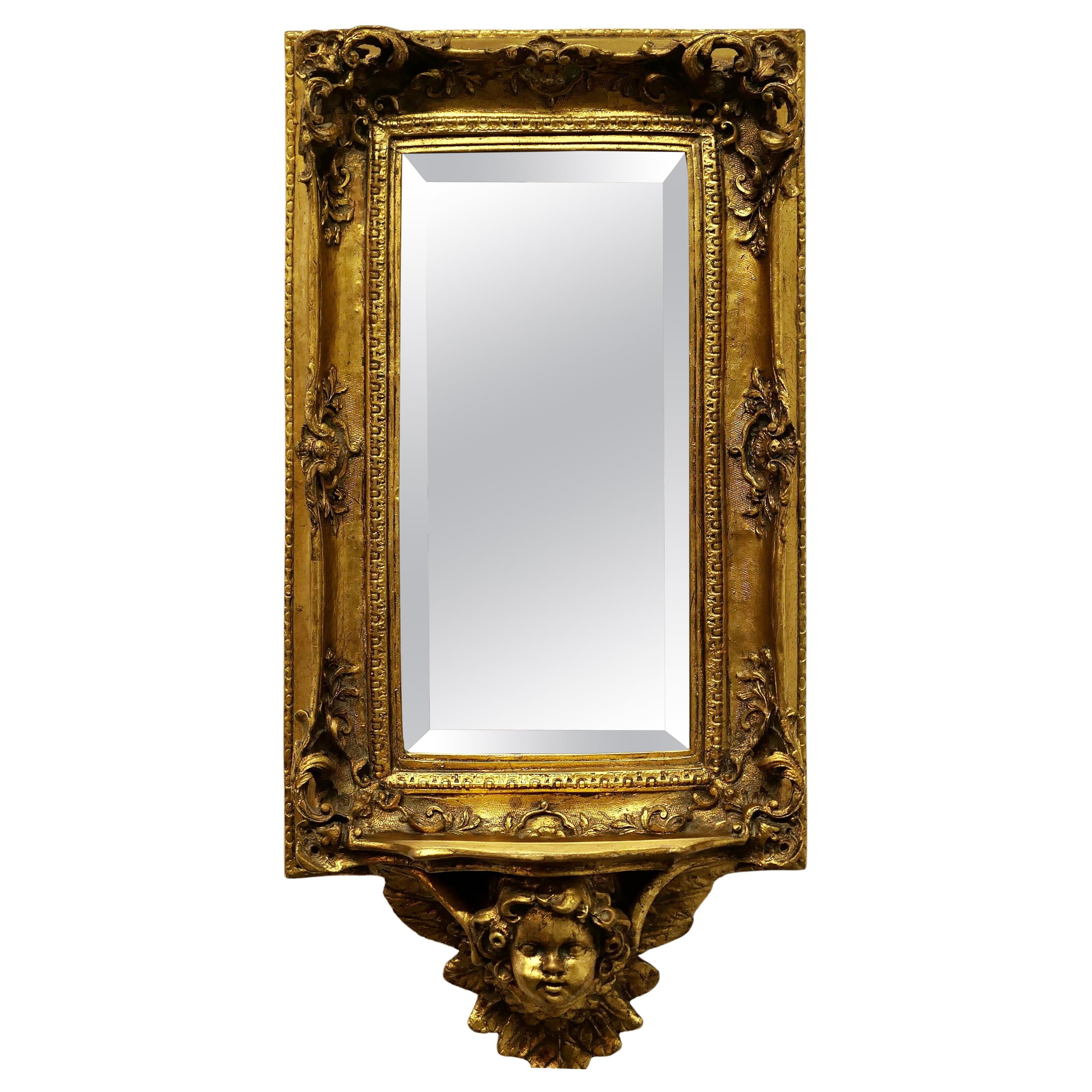 Rococo Style Gilt Wall Mirror with Putti and Shelf Bracket  For Sale