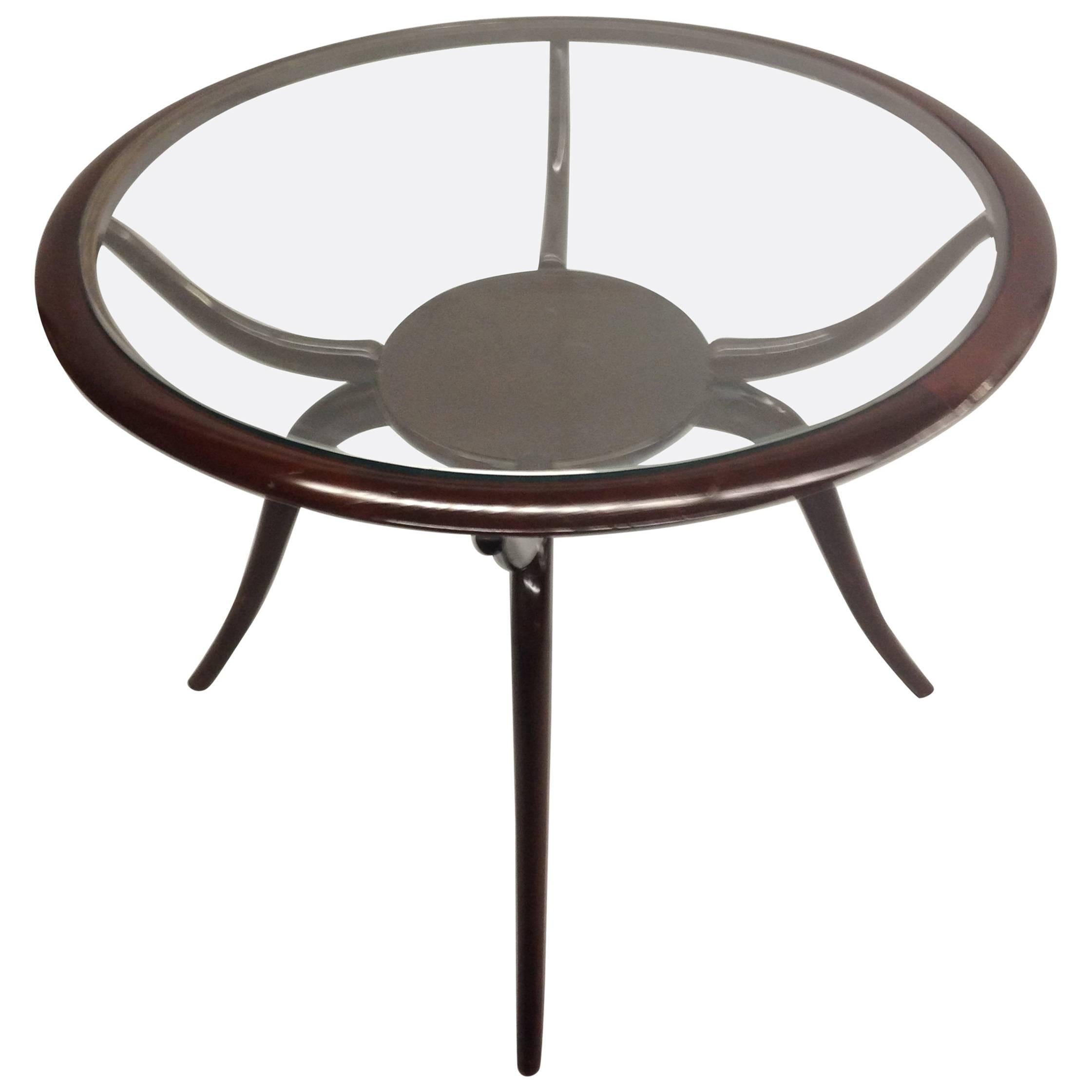 Elegant Italian midcentury arachnid / spider form cocktail table or side table or gueridon by Guglielmo Ulrich. 

Ulrich's work was influenced by Art Deco and a Sober Modern neoclassicism, both of which are seen in this delicate, sensuous piece.
