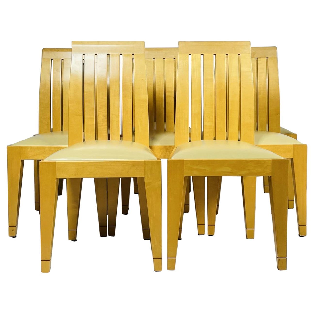 Set of 8 Dining Chairs in Blonde Wood and Leather Upholstery.