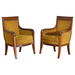 Pair French Restauration Period Walnut and Upholstered Bergeres, circa 1825