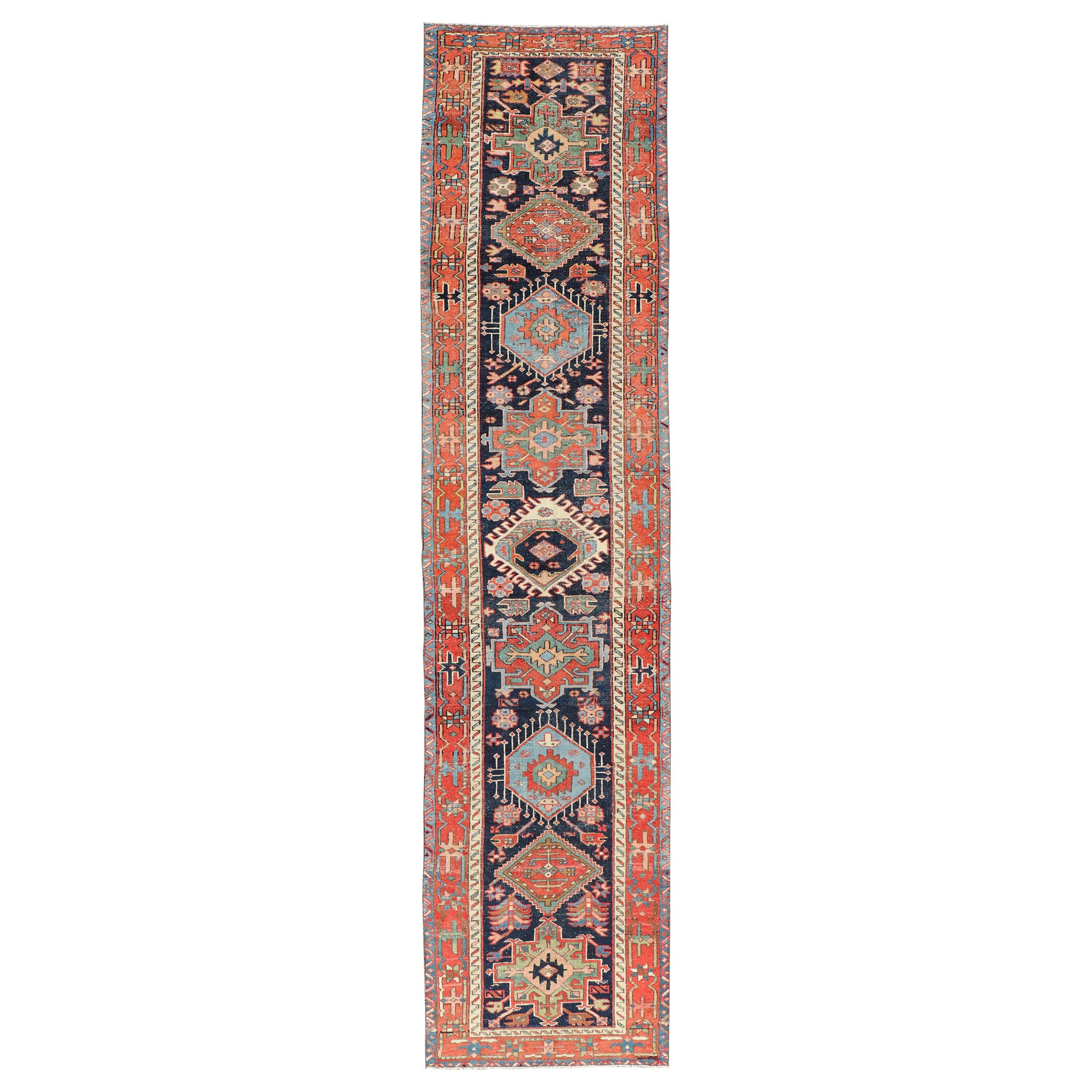 Antique Heriz Serapi Runner with Colorful Highly Stylized Medallion Design For Sale