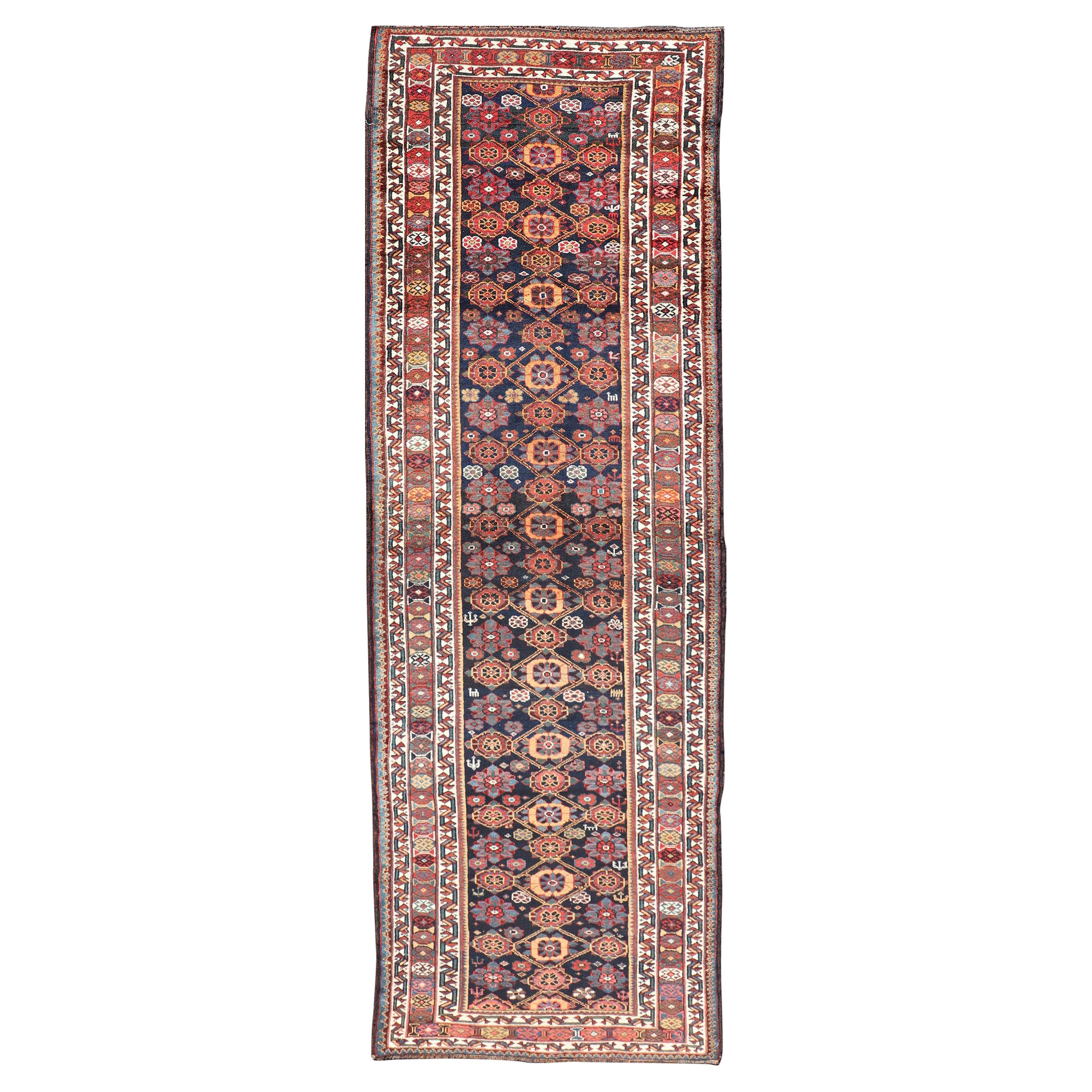 Colorful Antique Persian Lori Runner with Repeating Floral Palmette Design For Sale