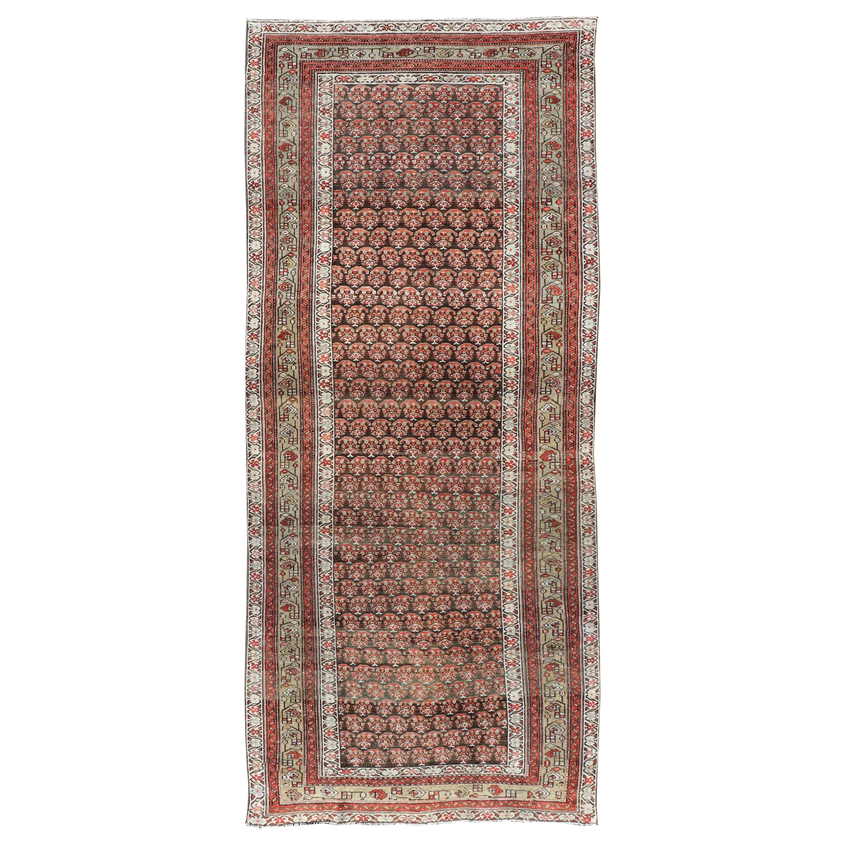Antique Kurdish Gallery Runner with All-Over Paisley Design in Brown, Red, Green For Sale