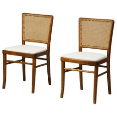 Ensemble de deux chaises finlandaises en bouleau et rotin produites par Wilhelm Schauman