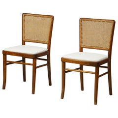 Conjunto de dos sillas finlandesas de abedul y ratán producidas por Wilhelm Schauman