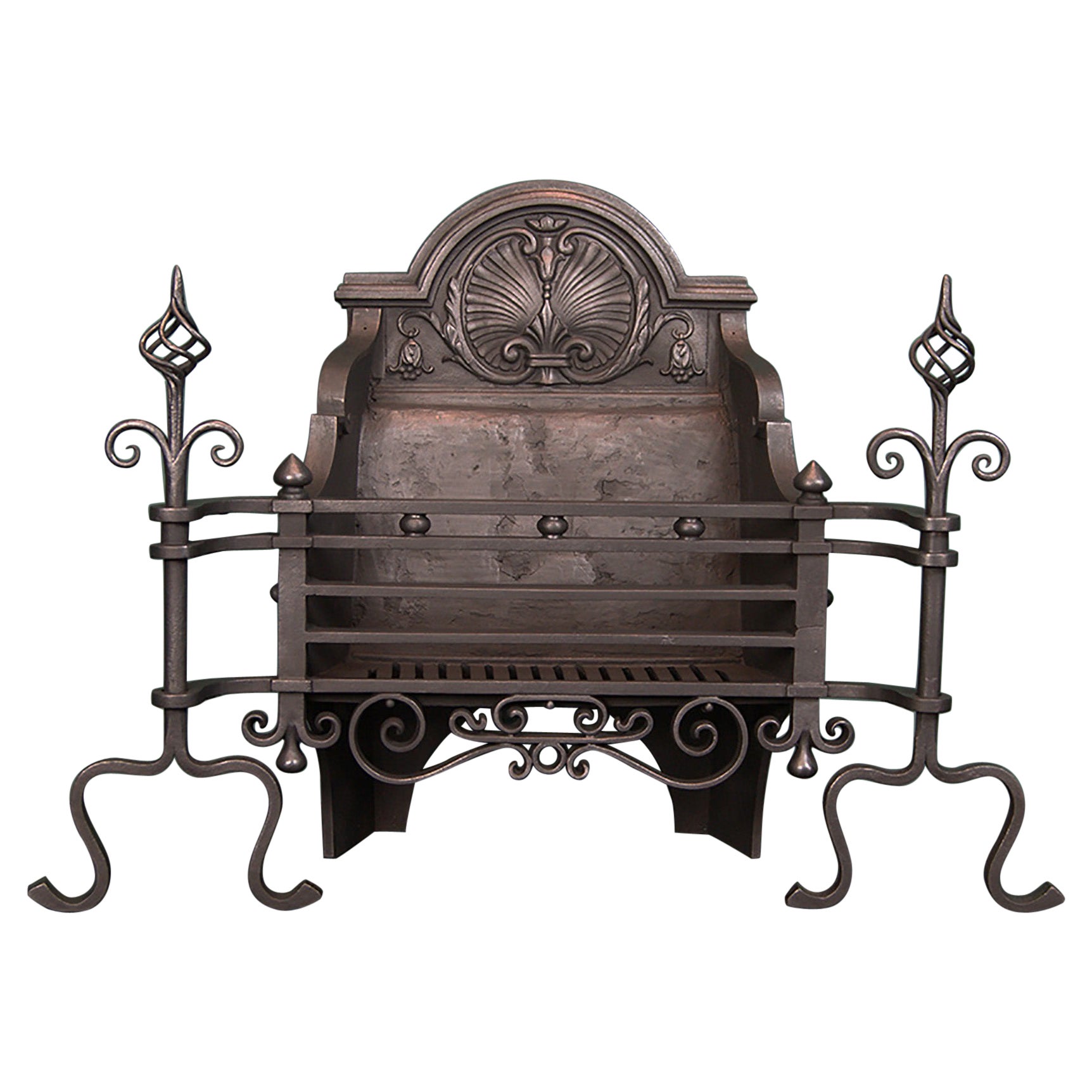 An Arts & Crafts Black Wrought Fire Grate with Shell Decoration