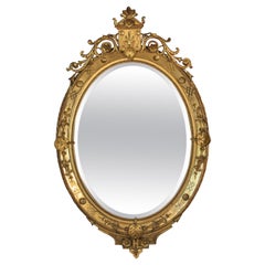 Miroir ovale français d'époque Louis XV du 18ème siècle en or doré