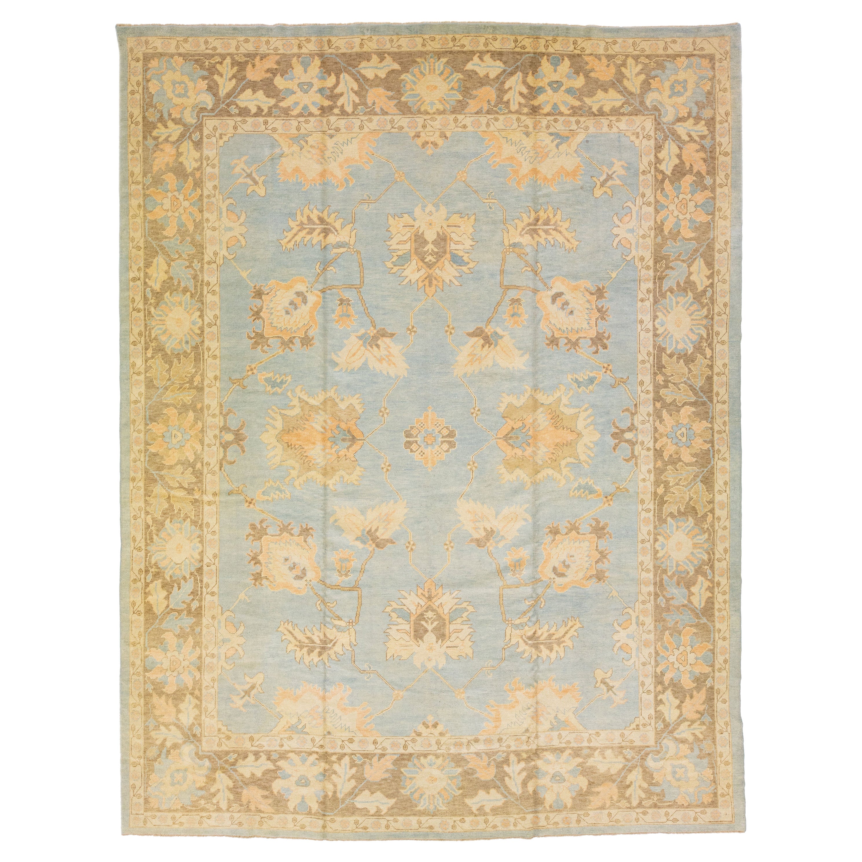 Handmade Modern Turkish Blue Wool Rug with Floral Field For Sale