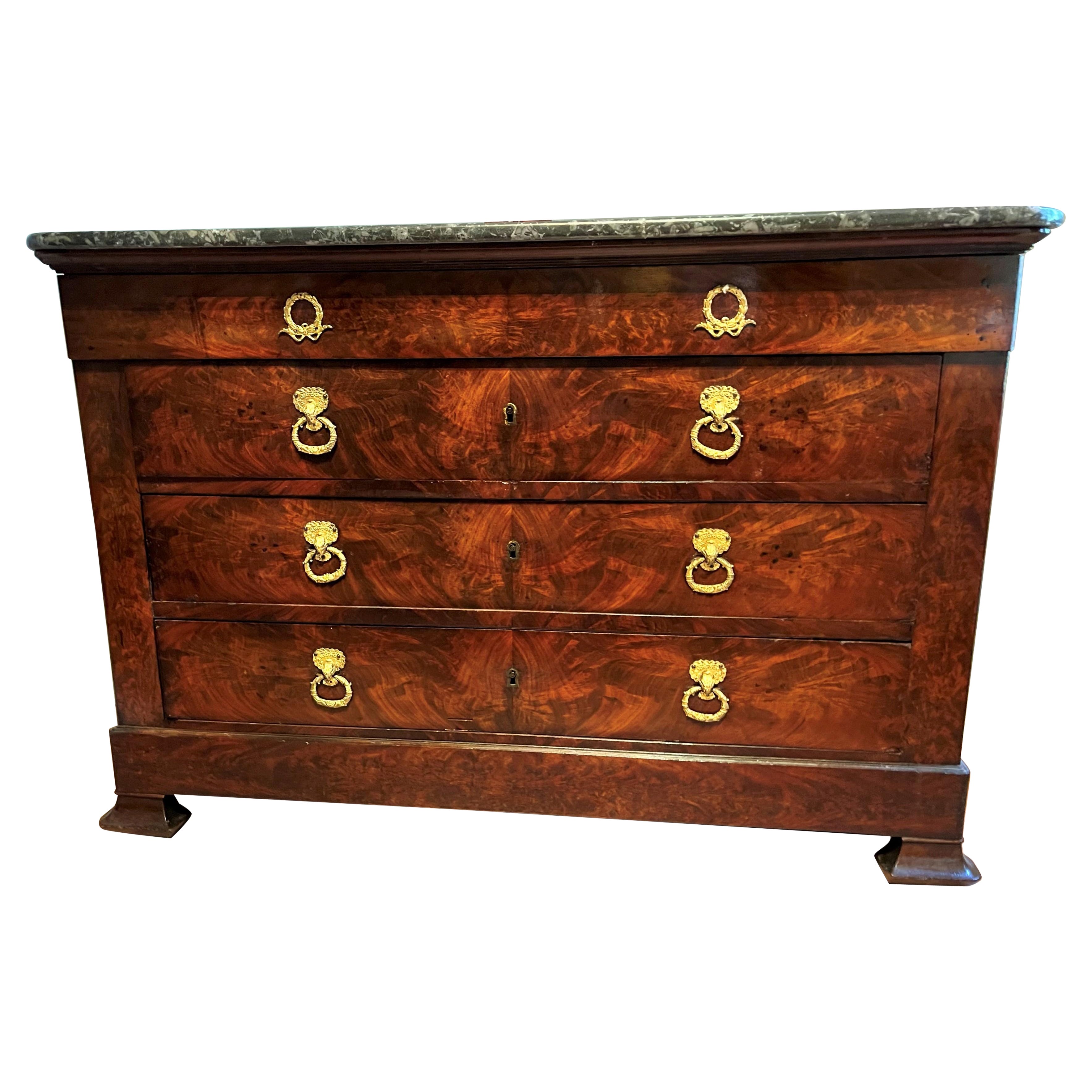 Stamped in each front corner ' MAIGRET ' ( Alexandre). Unusual in that the drawer veneers are the rare, highly figured crotch mahogany as opposed to the more common flame mahogany. Gilded mounts with hand hewn marble top .This chest has secondary