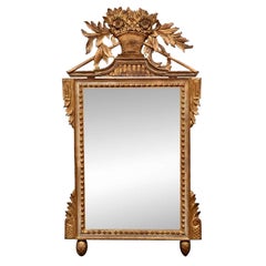 Antique Italian Carved and Gilt Beveled Mirror with Floral Basket Crest