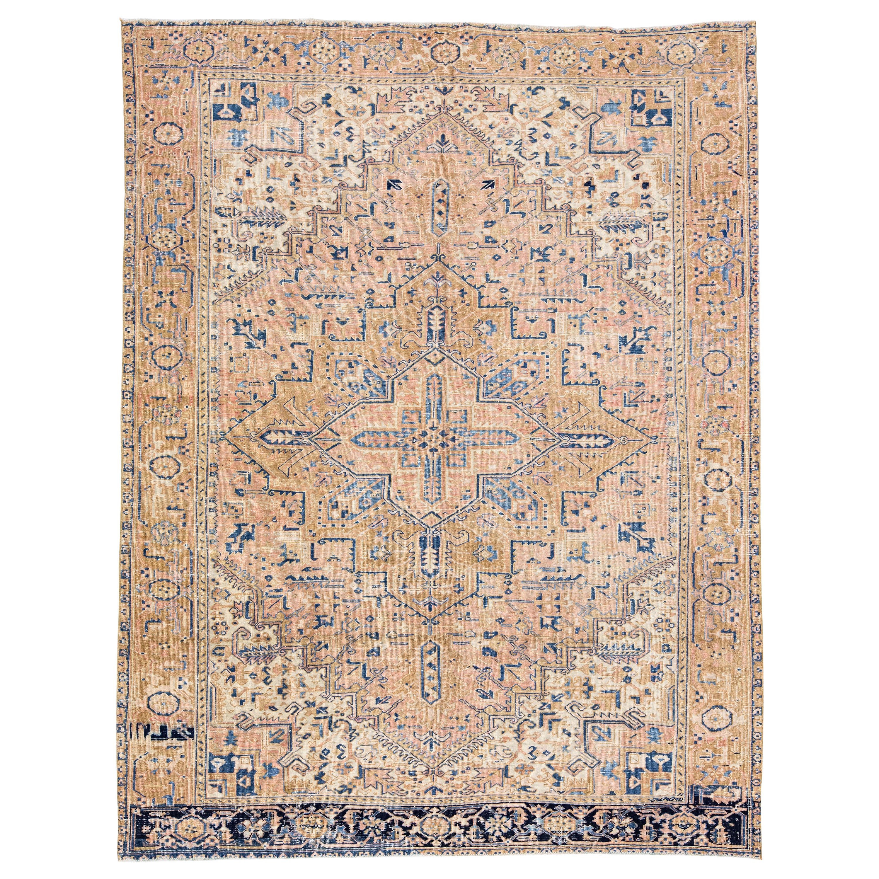 Handgefertigter antiker persischer Heriz-Teppich aus pfirsichfarbener Wolle mit Medaillon-Motiv