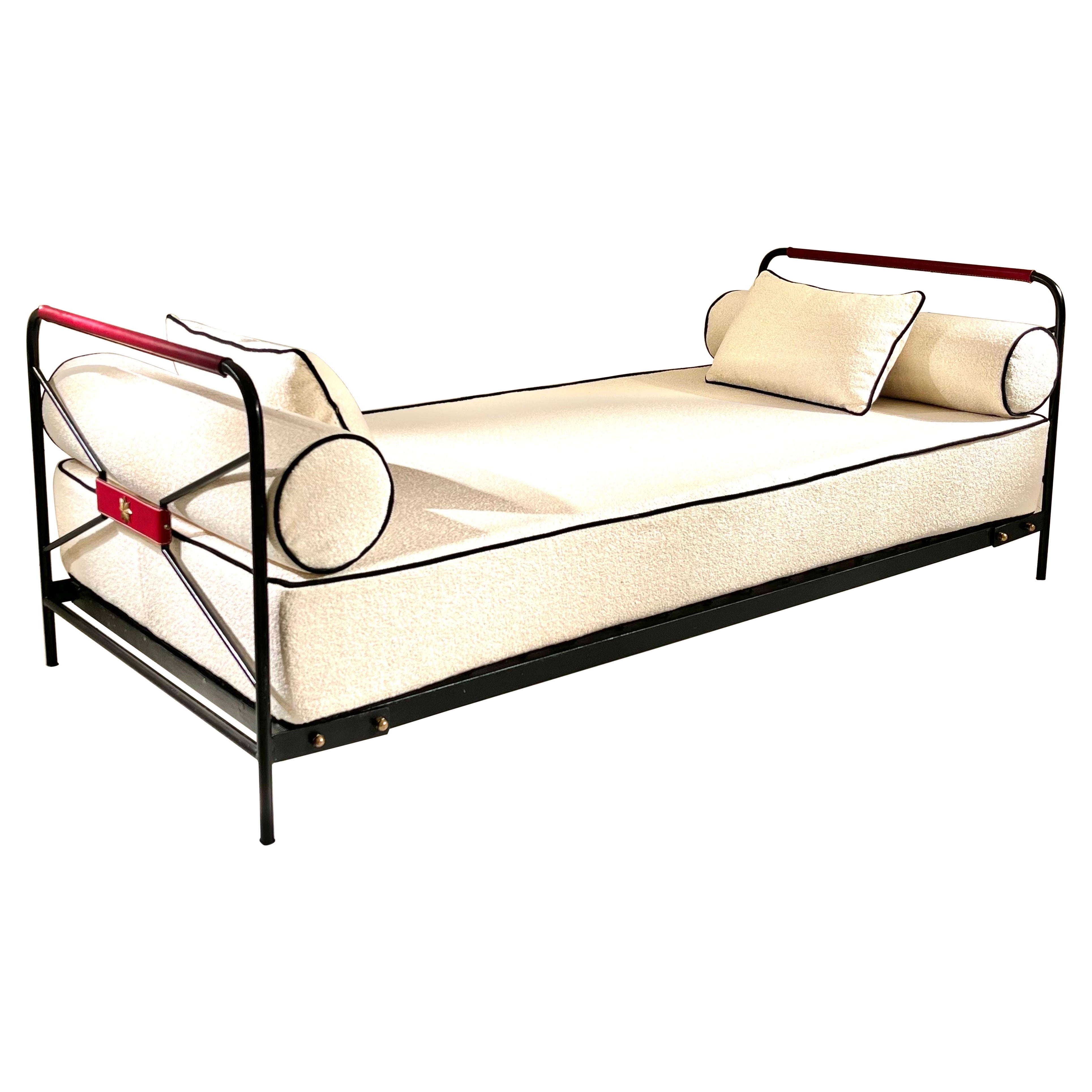Red Stiched leather and iron daybed by Jacques Adnet
2 Brass stars on the leather 
Great condition.