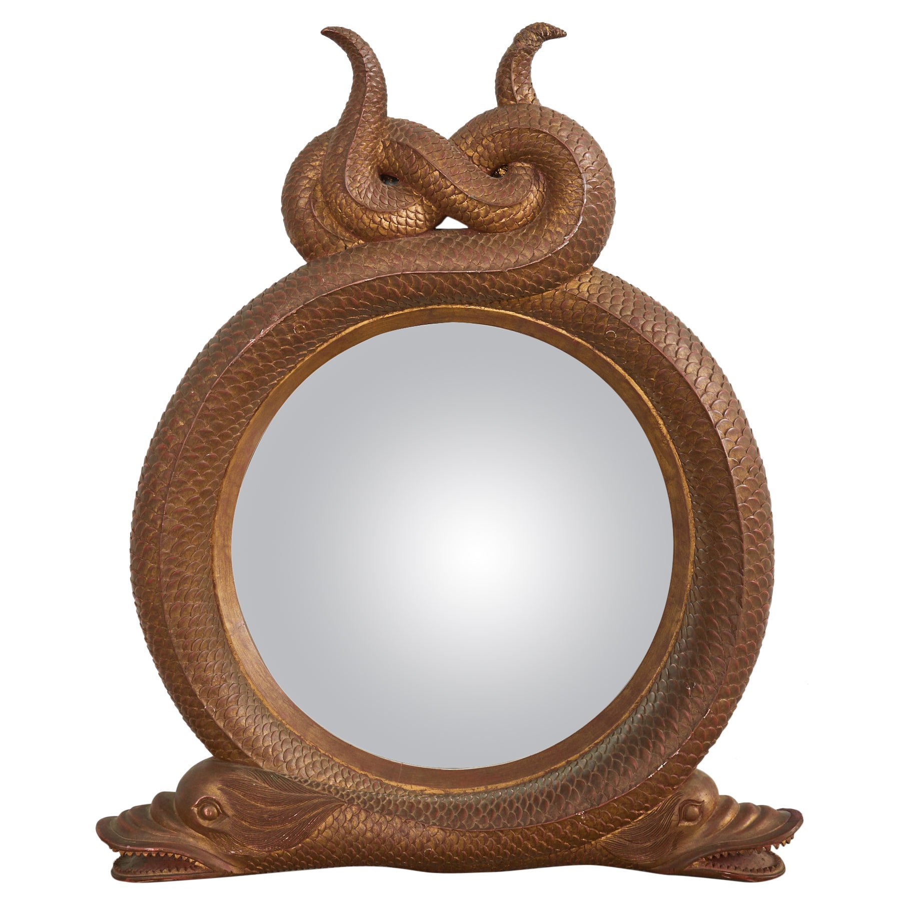 Miroir serpentin en bois doré sculpté de style Régence anglaise avec dauphins