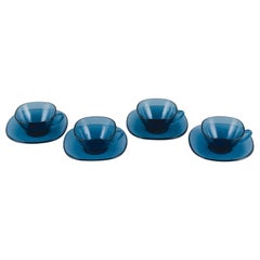 Vereco, France, a Set of Four Teacups and Matching Saucers in Blue Glass