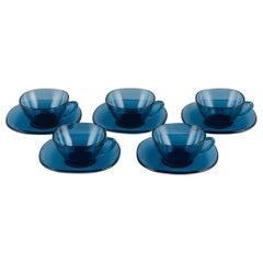 Vereco, France, Set of Five Teacups and Matching Saucers in Blue Glass. 