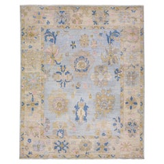 Tapis en laine bleu à motifs floraux fait à la main dans le style Oushak