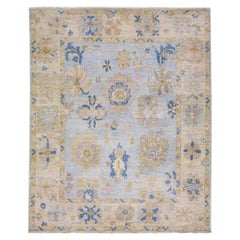 Tapis en laine bleu à motifs floraux fait à la main dans le style Oushak