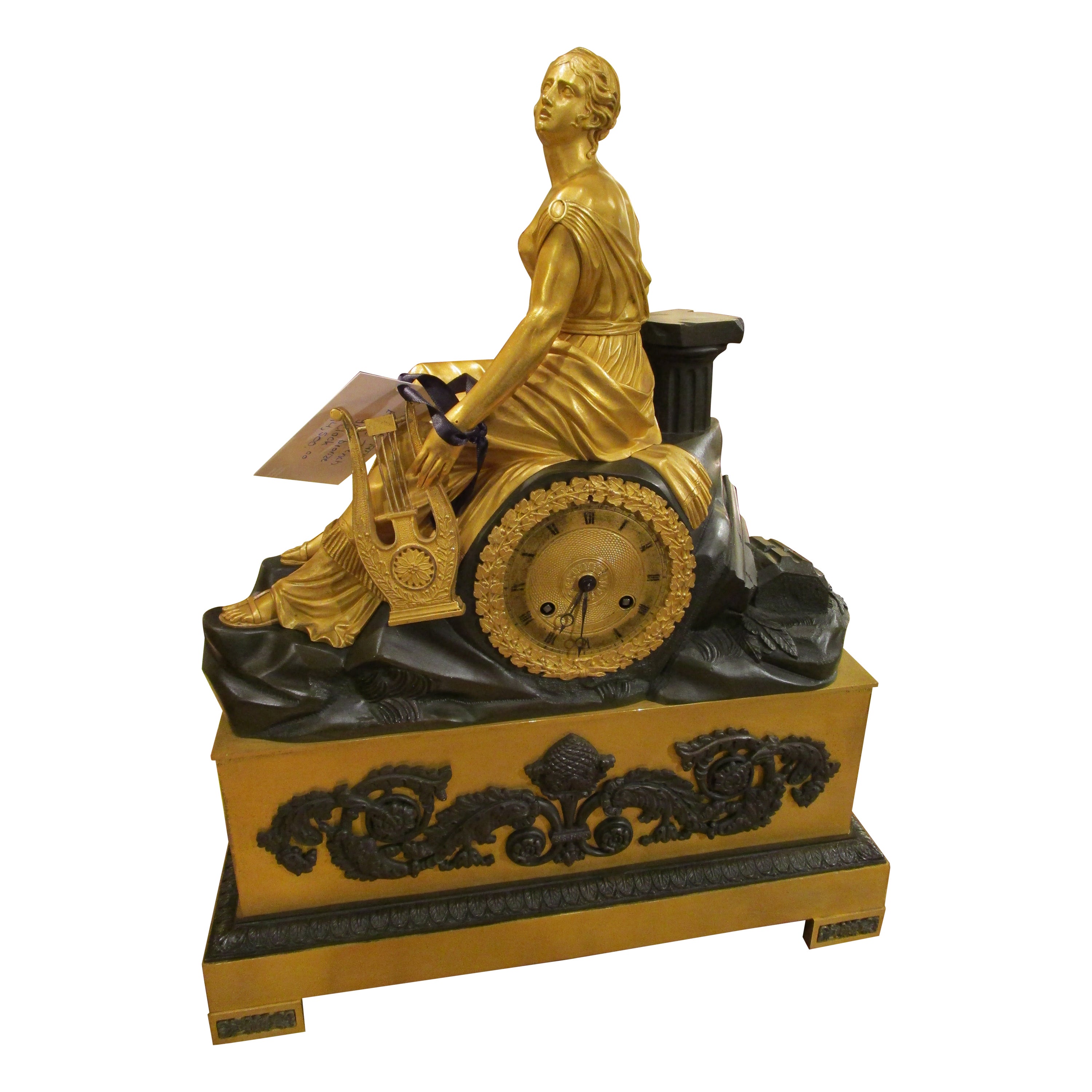 Belle horloge de cheminée Empire française du 19ème siècle en bronze doré et bronze patiné en vente