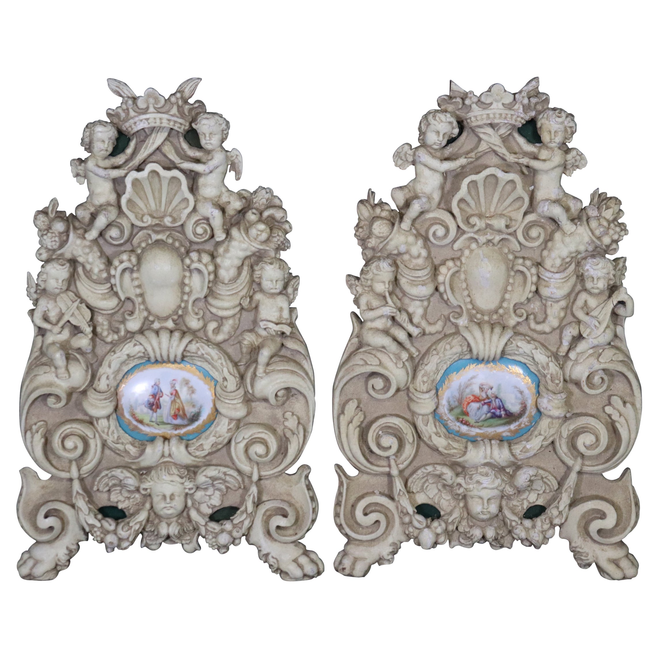 Pair French Figural Carved Wall Decorations with Sevres Style Plaques For Sale