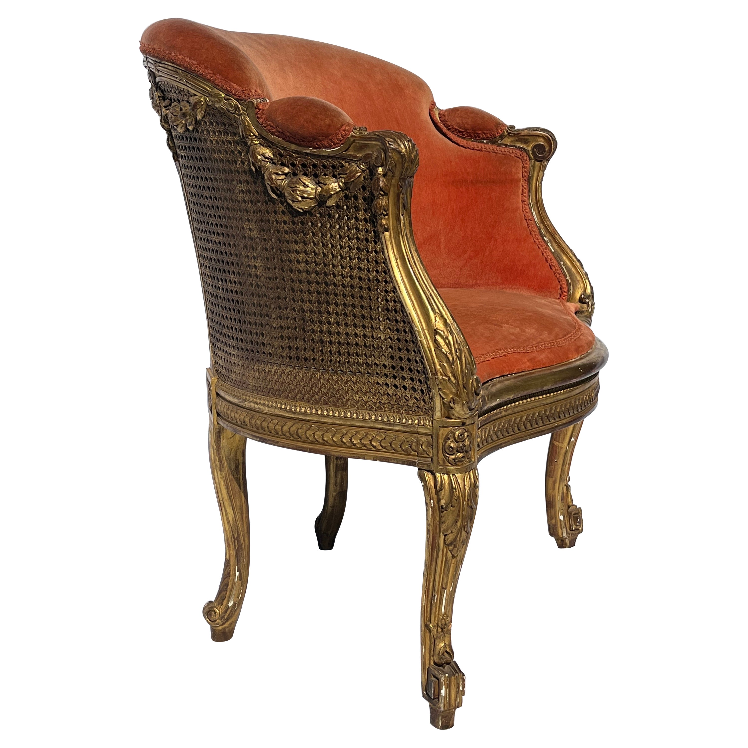 Antiker französischer gepolsterter Bergere-Sessel aus vergoldetem und geschnitztem Rohr aus dem 19. Jahrhundert