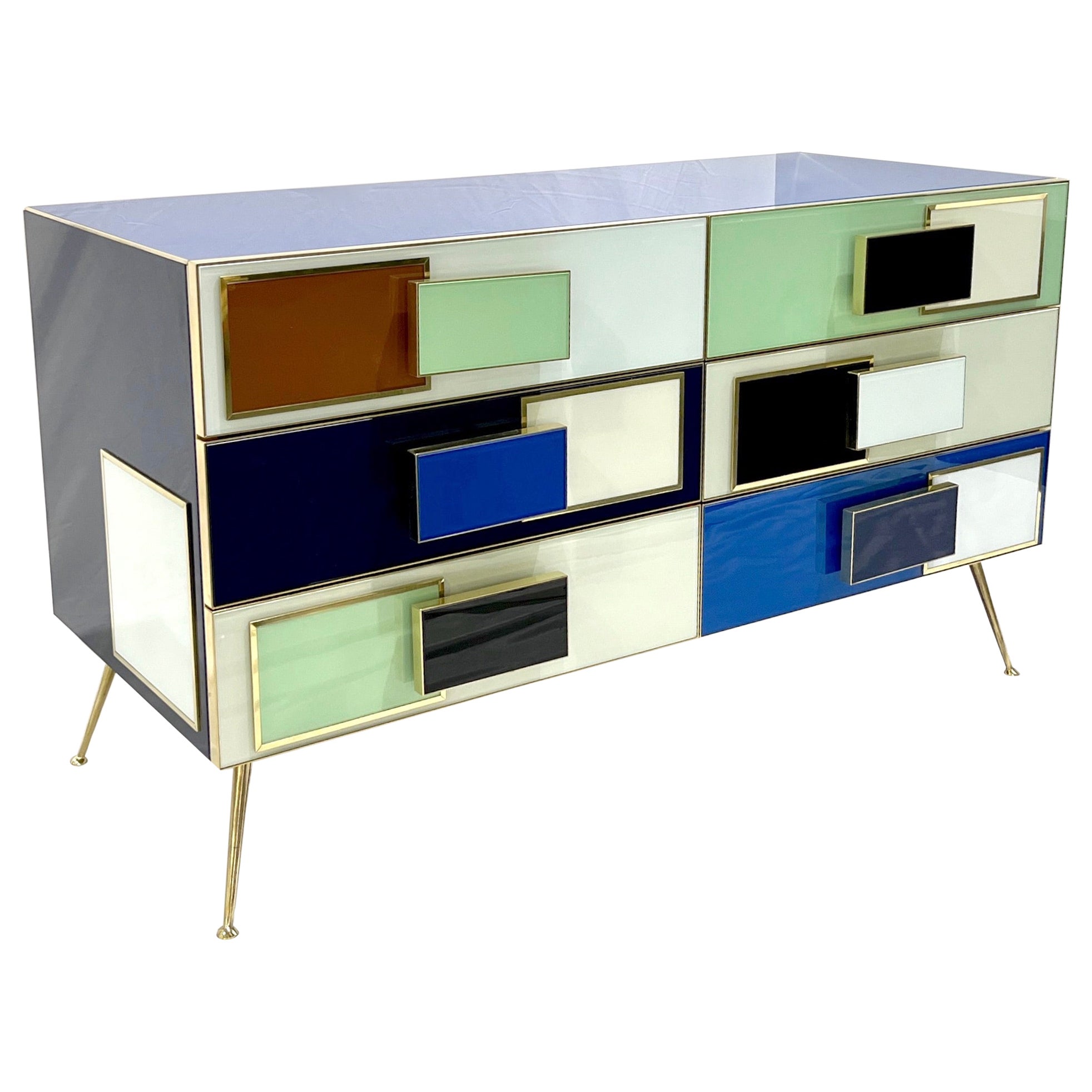 Contemporary modern graphic Pop Art design six-drawer dresser/sideboard, entirely handcrafted in Italy, with a Piet Mondrian inspired abstract decor, the surrounds edged in natural brass trim are in reversed hand-painted colored glass: navy blue,