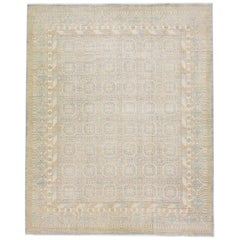 Tapis surdimensionné de style Khotan en laine beige à motif géométrique