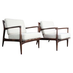 Pair of Danish Modern Lounge Chairs in Bouclé and Walnut by Kofod Larsen