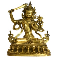 Bouddha tibétain en bronze doré souriant Manjushree