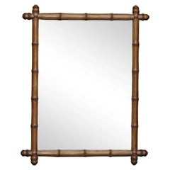 Antique French 1920s Faux Bamboo Walnut Mirror with Protruding Corners and Brown Patina