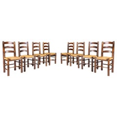 Georges Robert Dining Chairs in Patinated Oak and Rush, France, 1950s