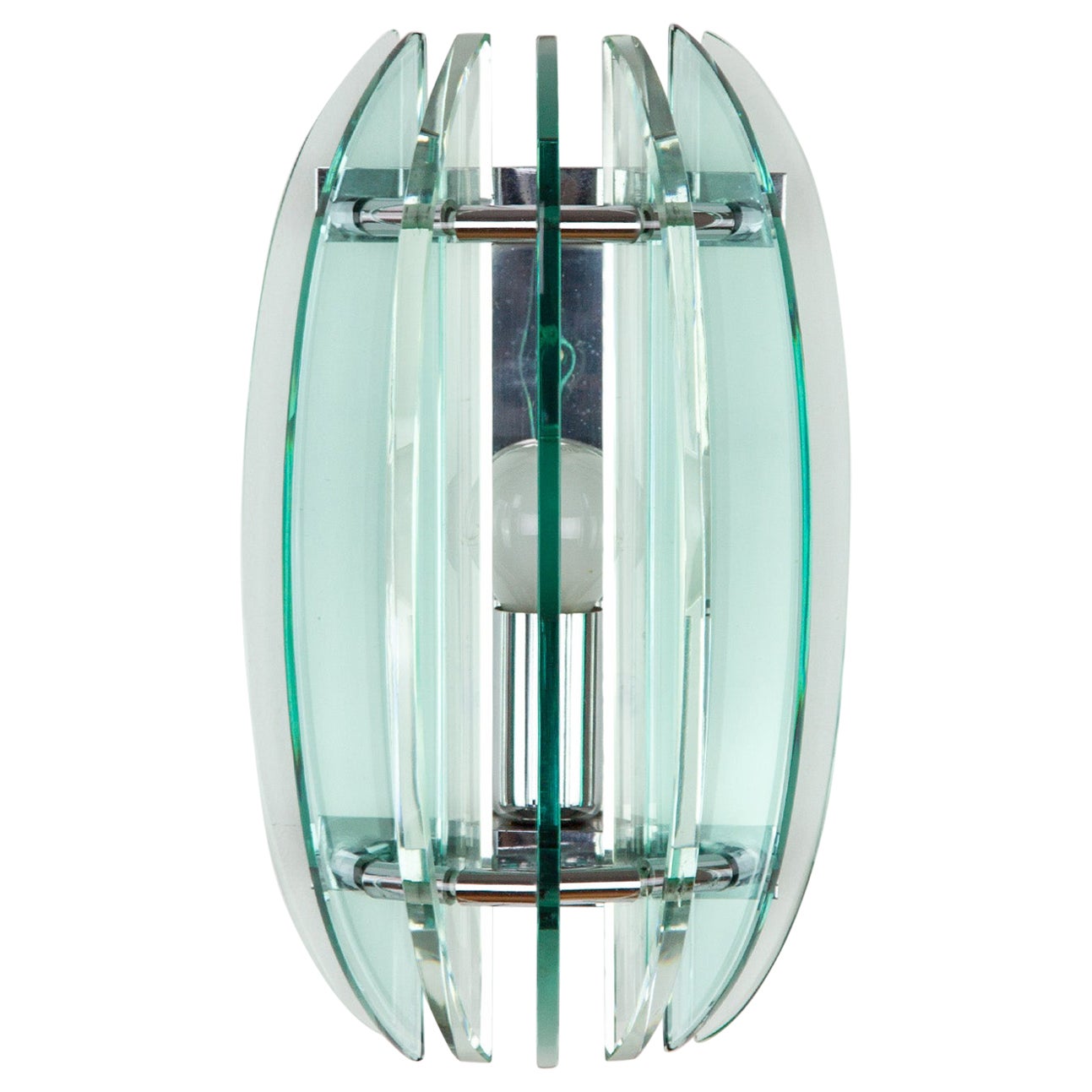 Lovely Italian wall light in pale green and clear glass by Veca. Held by a chrome metal bracket in a circular pattern with one light socket. The light colored glass emits a soft and vibrant hue. The light colors give the sconce a lightness and
